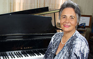 Margaret Brandman sitting at the piano
